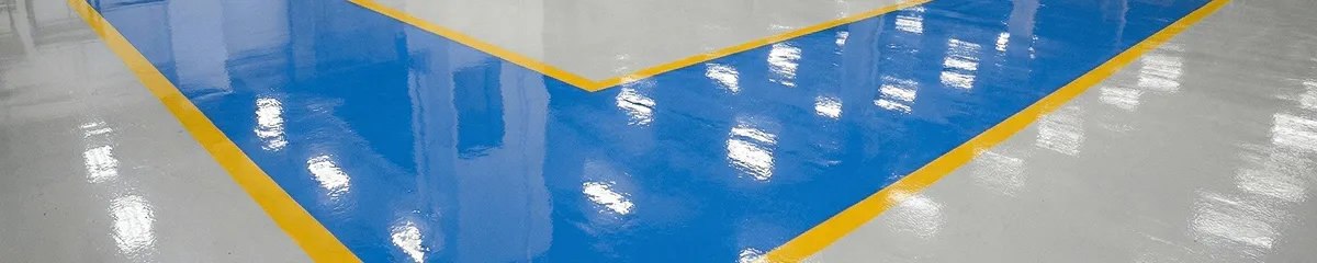 A factory floor professionally covered and marked with epoxy flooring in Omaha, NE