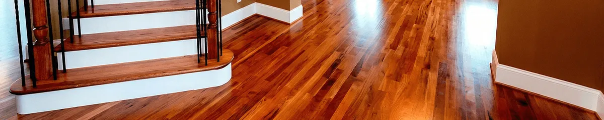 Base floor of a staircase with professionally restored wood flooring in Omaha NE