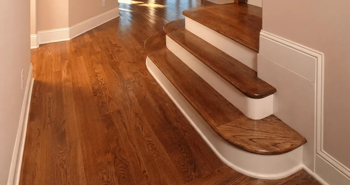 Base floor of a staircase with professionally restored wood flooring in Omaha NE