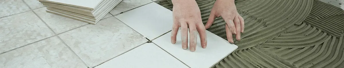 Professional installing white tile floors in Omaha, NE