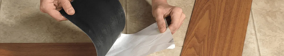A professional installing vinyl flooring in Omaha, NE